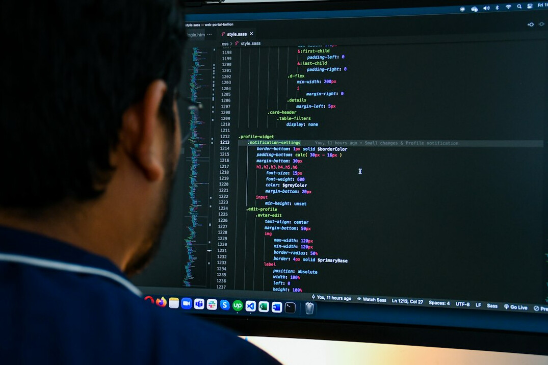 person reviewing code on screen