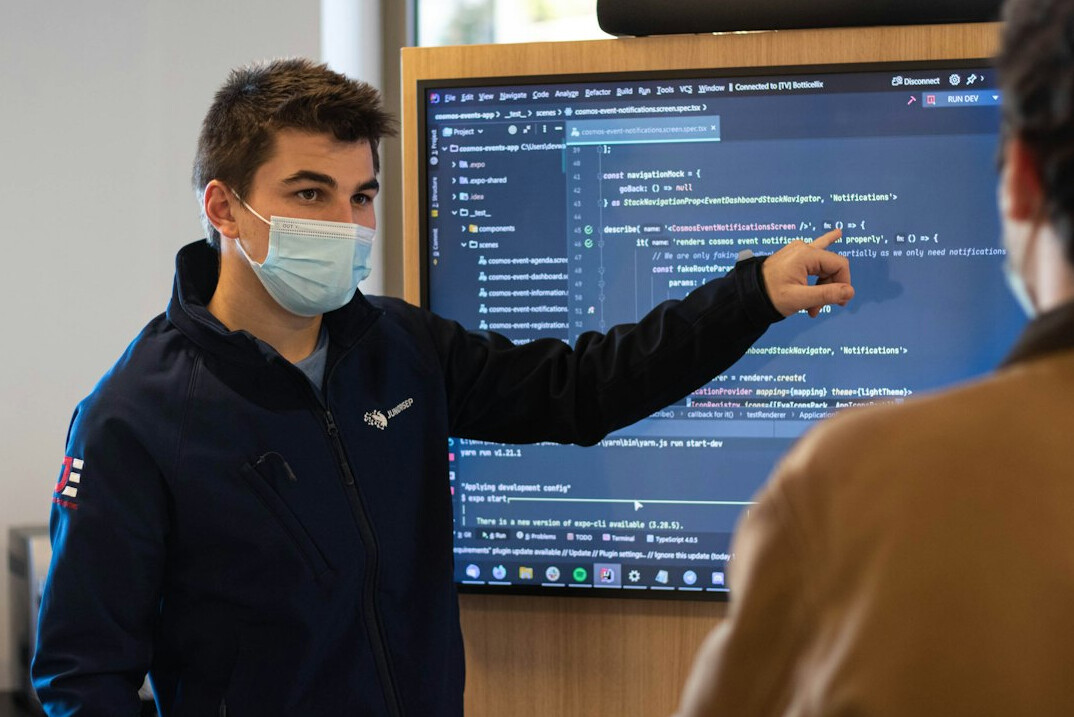 coding mentor helping student