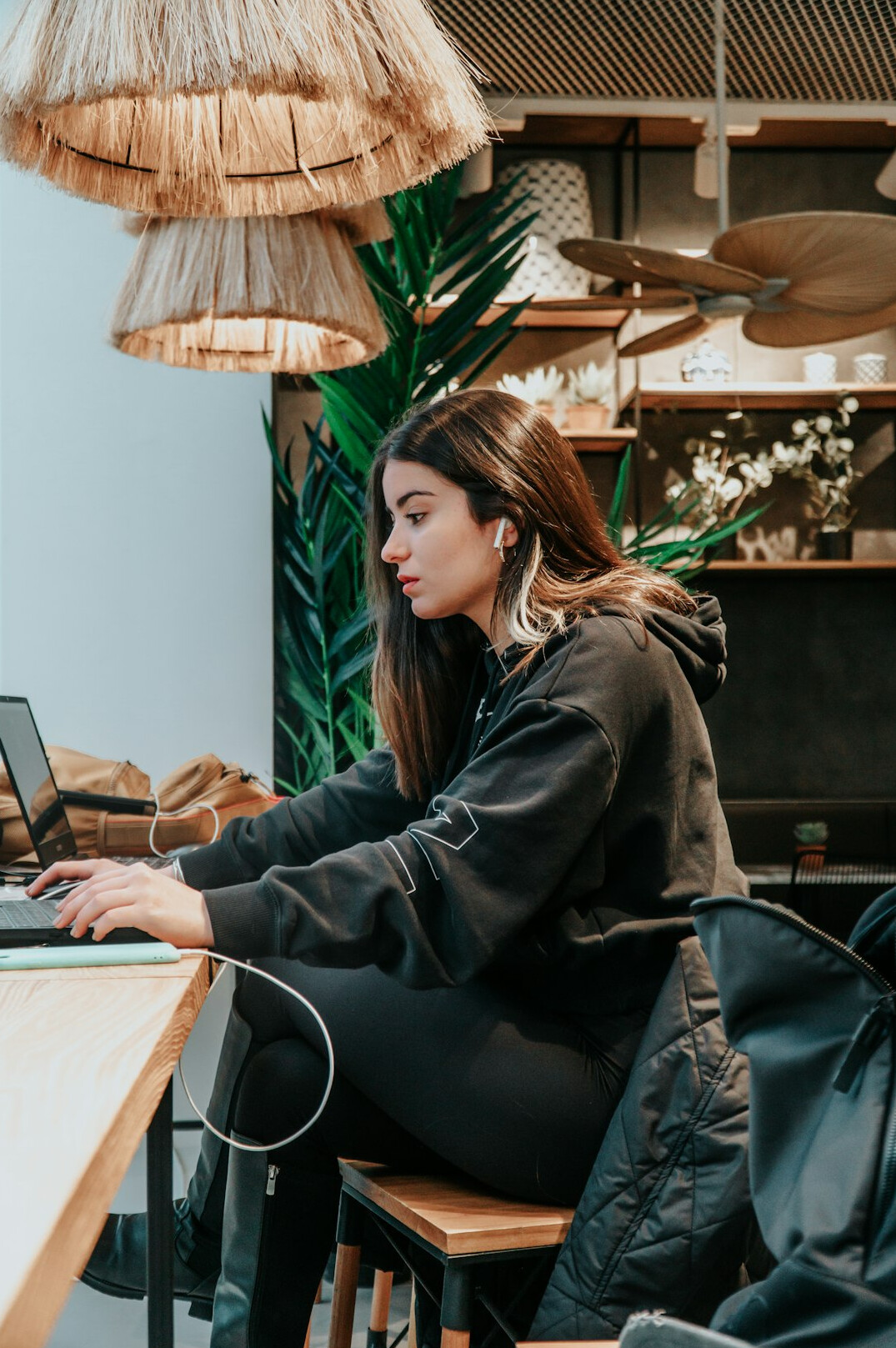 woman studying programming at cafe