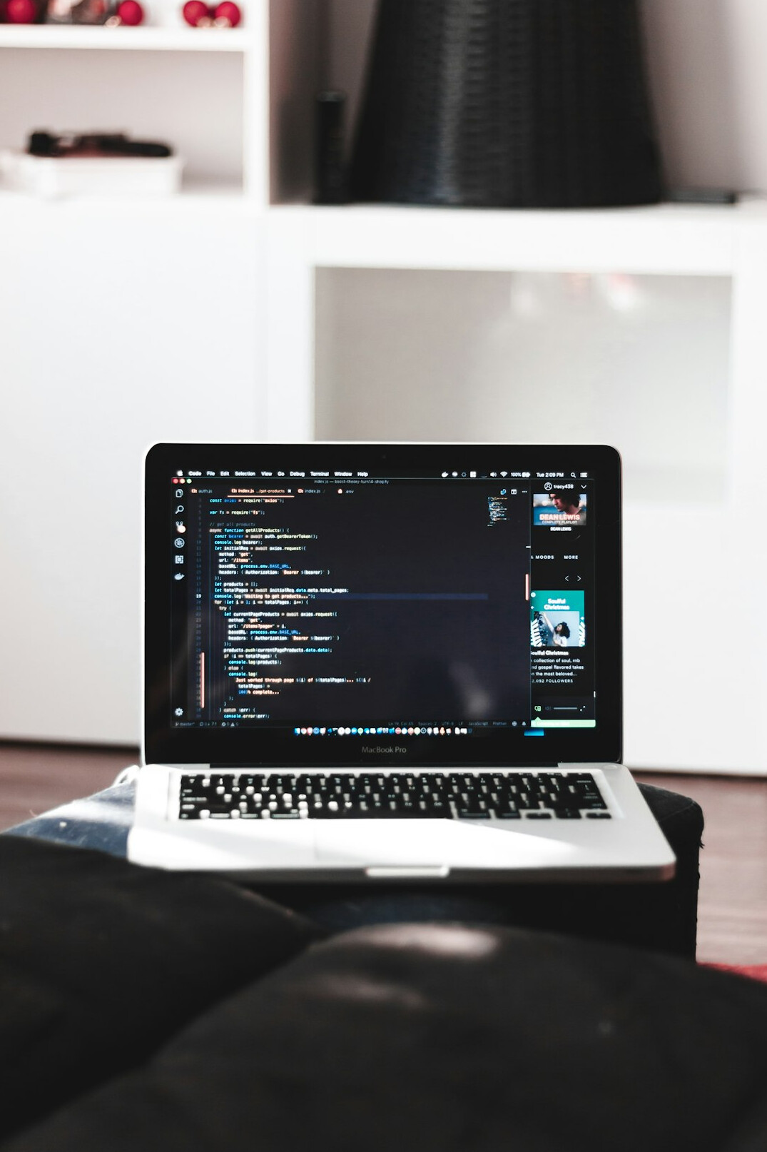 person coding on laptop at home