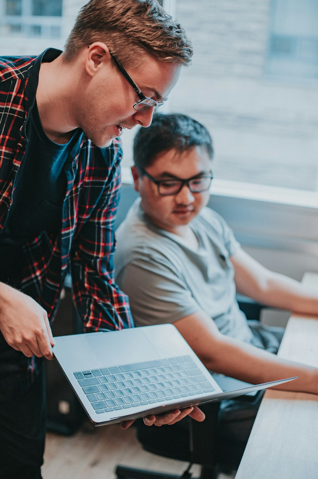 students coding together