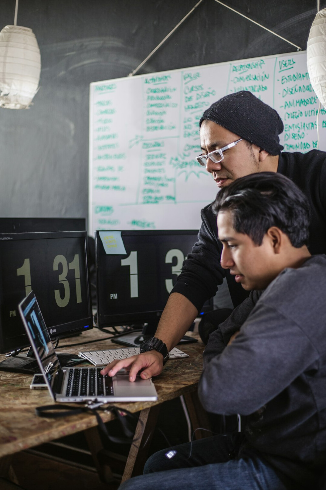 teacher helping student with code