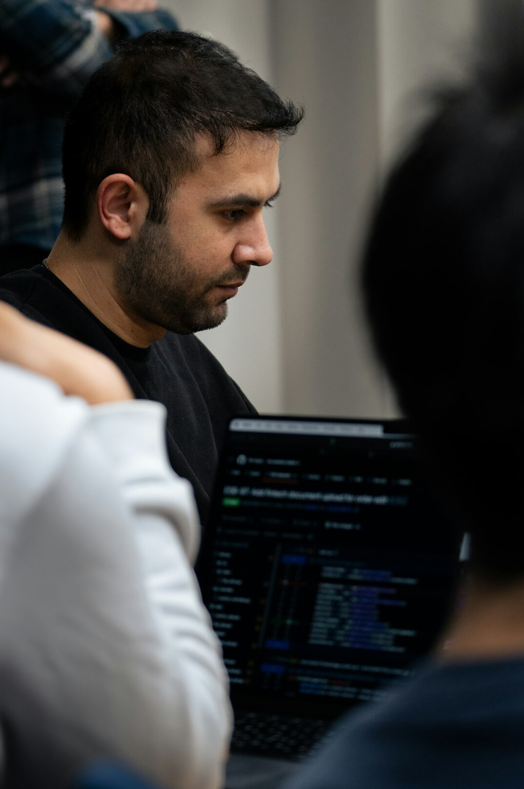 croatian student coding on laptop